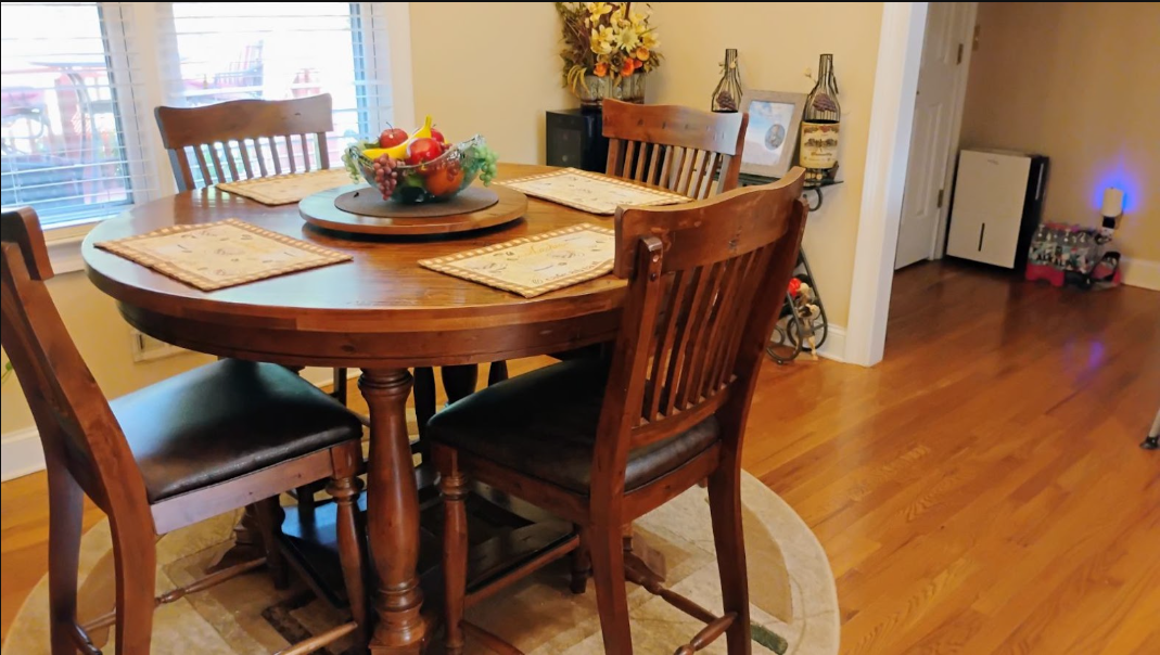 Cleaned and staged dining nook with polished hardwood floors