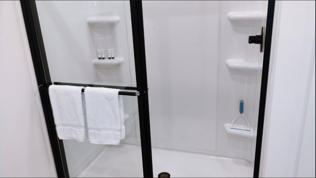 Detailed shower cleaning with fresh towels