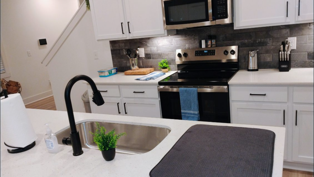 Bright modern kitchen with spotless quartz counters