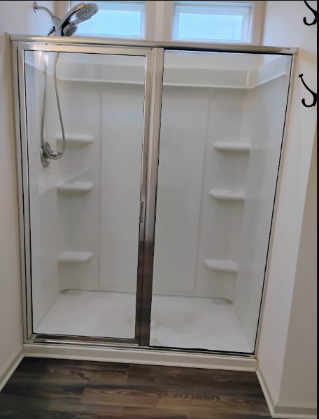 Streak-free walk-in shower with polished glass doors