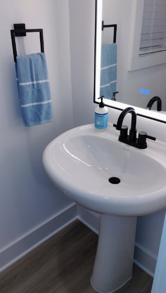 Sparkling powder room with pedestal sink