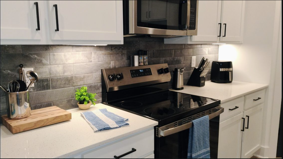 Bright kitchen with spotless stovetop and counters